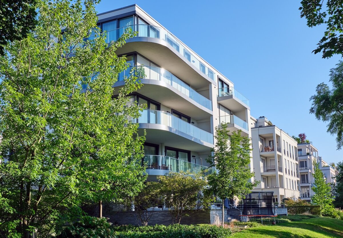 residential building with trees from street