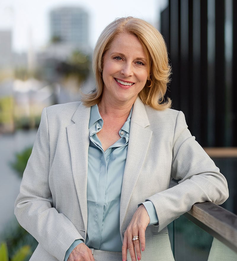 Woman smiling with cityscape background