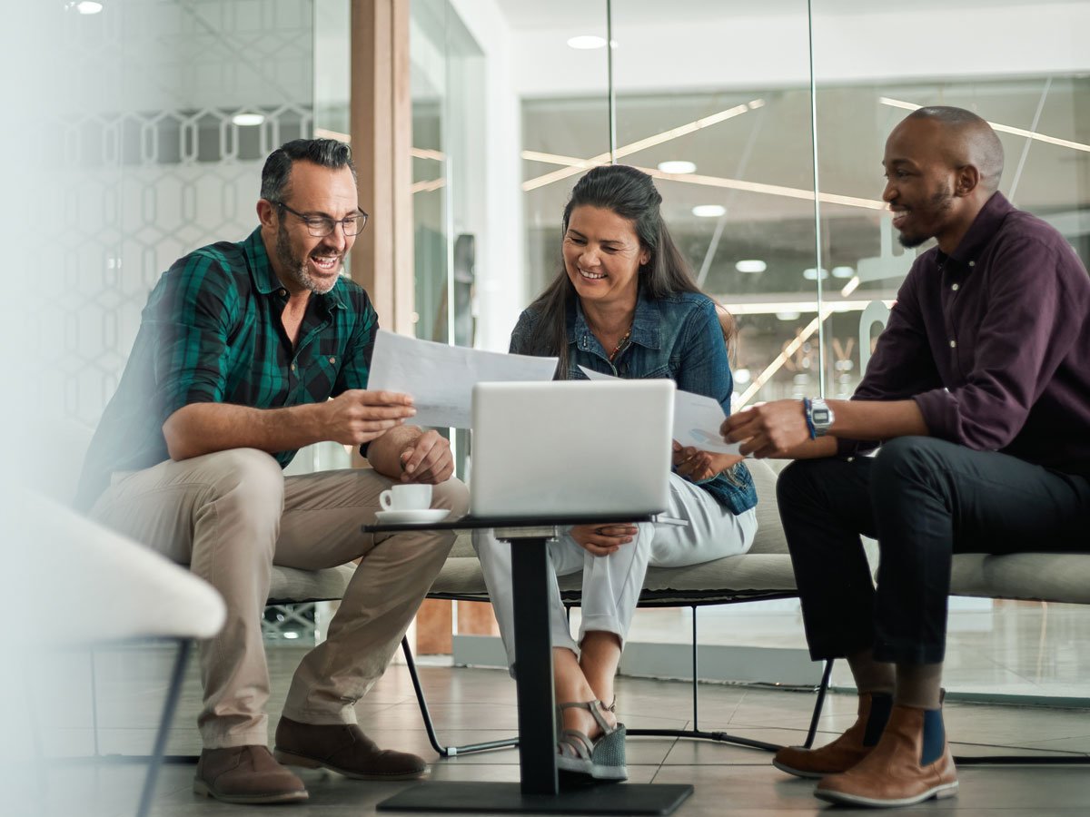 three people meeting to discuss loan options