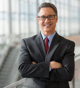 businessman standing and smiling